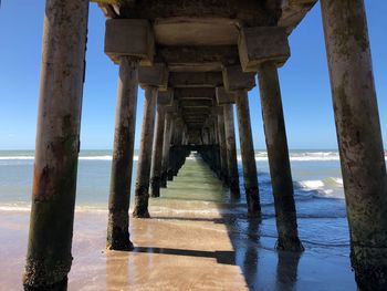 Pier over sea against sky