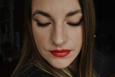 Close-up of beautiful young woman with make-up