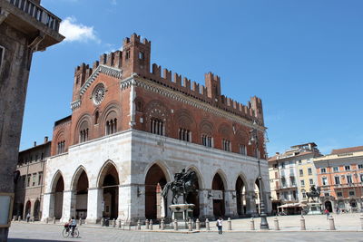 Piacenza,  central square with particular equestrian statues on the sides of the governor palace.