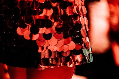 Close-up of red flower hanging on clothesline