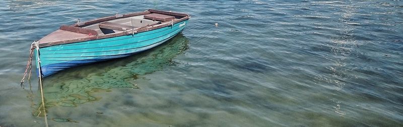 High angle view of boat moored in water