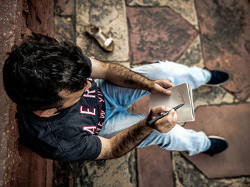 High angle view of man using mobile phone