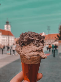 Close-up of hand holding ice cream cone