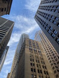 Low angle view of skyscrapers against sky