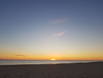 View of beach against sky during sunset