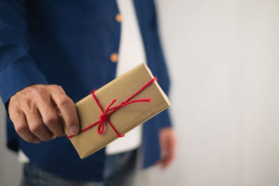 Close-up of a hand holding paper