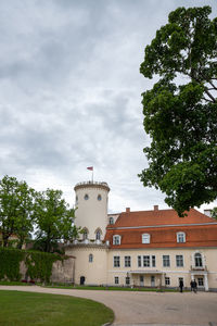 Exterior of buildings in town against sky