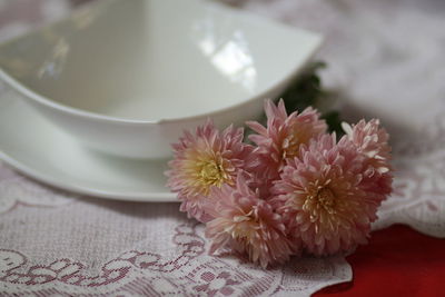 Close-up of pink flower on table