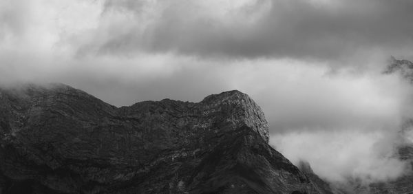 Low angle view of rock formation against sky