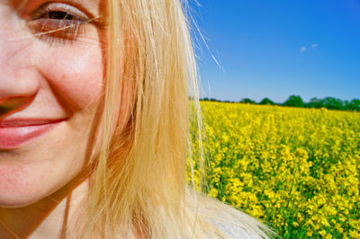 Woman with flowers in field