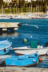 Boats moored at harbor