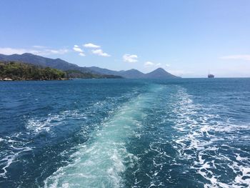 Scenic view of sea against blue sky