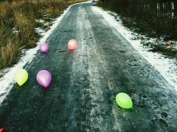 High angle view of balloons on road