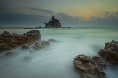 Scenic view of sea against sky at sunset