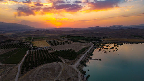 Scenic view of landscape against sky during sunset