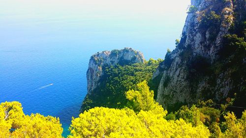 Scenic view of sea with mountains in background