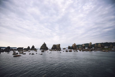 Panoramic view of sea against cloudy sky