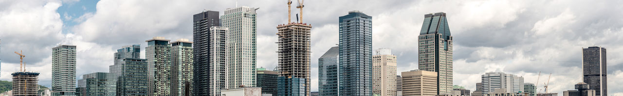 Low angle view of modern buildings against sky