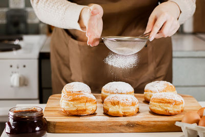 Midsection of woman preparing food