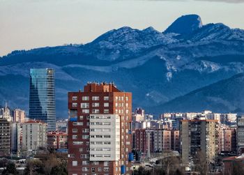 Buildings in city against sky