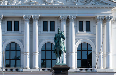 Low angle view of statue against historic building kaiser wilhelm rathaus altona