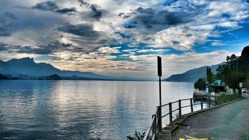 Scenic view of lake and mountains against sky