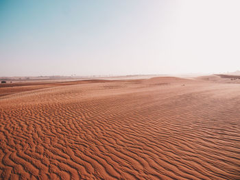 Scenic view of desert against clear sky