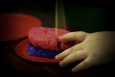 Cropped hand holding ice cream