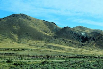 Scenic view of landscape and mountains against sky