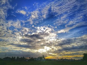 Scenic view of landscape against sky at sunset