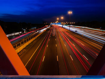 High angle view of light trails on highway at night