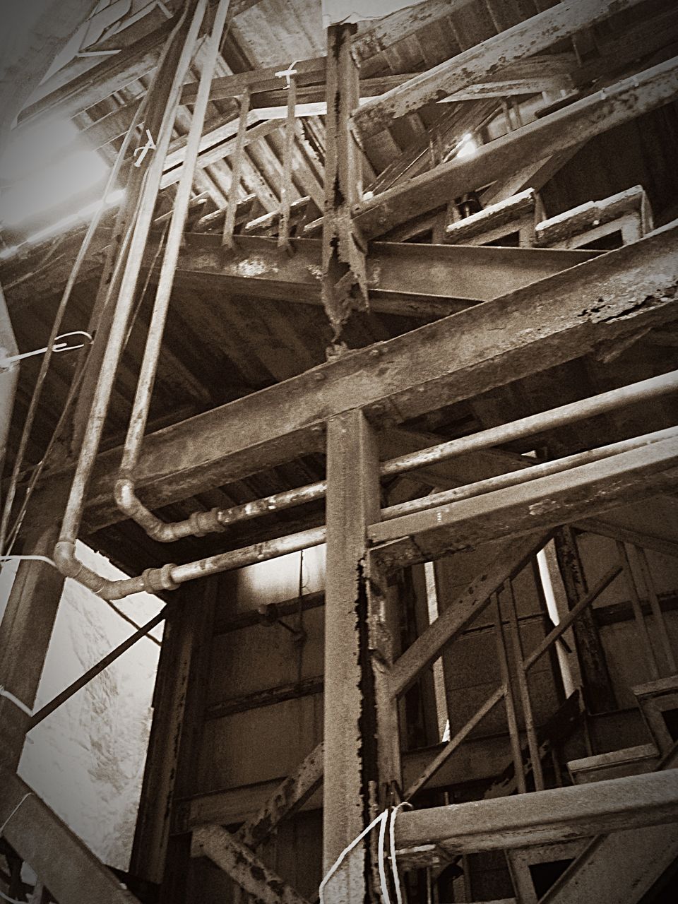 architecture, built structure, low angle view, building exterior, abandoned, old, damaged, building, obsolete, indoors, run-down, no people, night, deterioration, window, staircase, metal, railing, house, factory