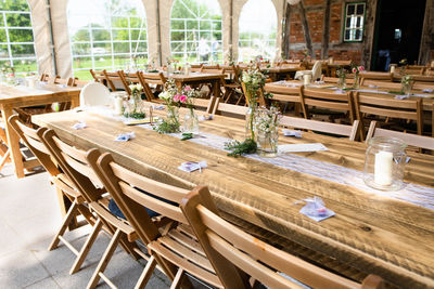 Empty chairs and tables in restaurant