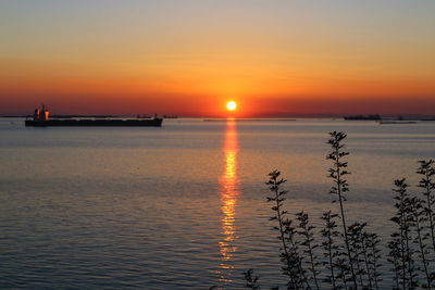 Scenic view of sea against sky during sunset