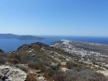 Scenic view of sea against clear blue sky