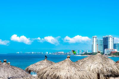 Panoramic view of sea against blue sky