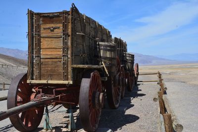 Abandoned truck on land against sky