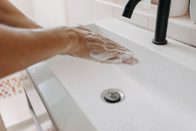 Midsection of man in bathroom