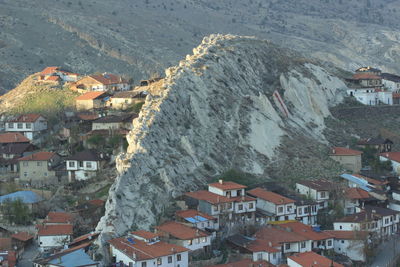 High angle view of houses and cityscape against sky