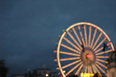 Low angle view of illuminated ferris wheel