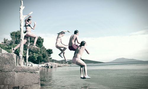 Woman jumping in water