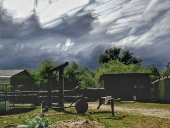 View of rural landscape against cloudy sky