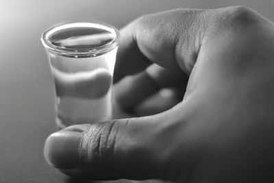 Close-up of hand holding drink