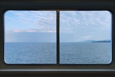 Scenic view of sea seen through window