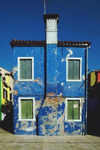 Houses against blue sky