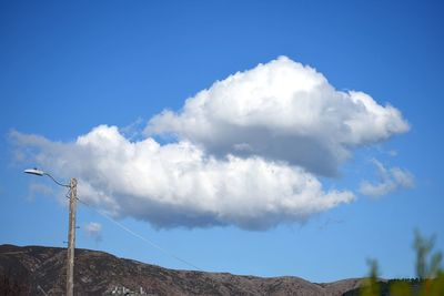 Low angle view of clouds against blue sky