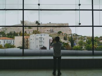 Rear view of woman against sky