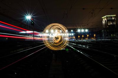 Light trails on railroad tracks at night