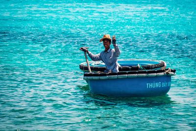 Man in boat on sea