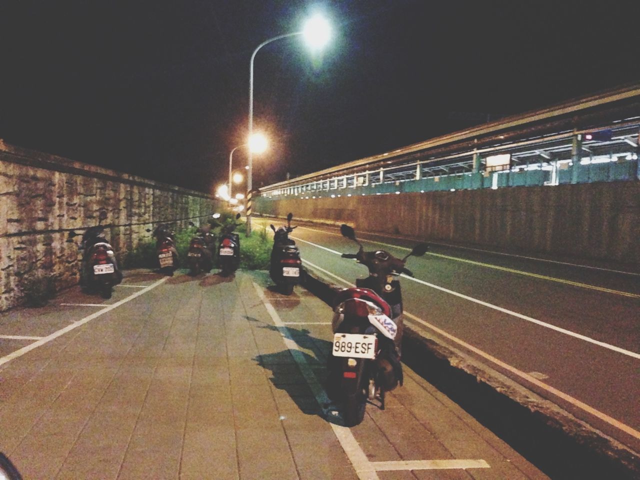 transportation, railroad track, railroad station platform, illuminated, railroad station, public transportation, rail transportation, mode of transport, night, the way forward, travel, on the move, incidental people, city life, city, built structure, street light, men, motion